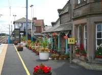 The down platform at Chathill, Northumberland, on the ECML, seen in August 2007 looking towards the station exit and level crossing. No passenger facilities exist on this side of the station as train departures (one in the morning and one in the evening) to Newcastle are from the up platform, where a noteworthy passenger waiting room still stands [see image 16285]. Until 1951 Chathill was also the western terminus of the North Sunderland Light Railway, opened in 1898, running to the village of Seahouses on the Northumberland coast.<br><br>[John Furnevel 16/08/2007]