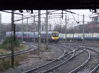 185103 passes the remains of the Ladywell Sidings to the North of Preston station on a service to Manchester Airport. The sidings are now used as an engineers depot <br><br>[Graham Morgan 07/01/2009]