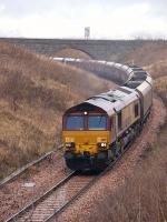 EWS 66197 passes Kilbagie on 20 January 2009 with a Hunterston-Longannet coal train on the direct route via Stirling and Alloa.<br><br>[Bill Roberton 20/01/2009]