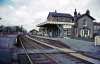 The deserted platforms of the closed station at Histon, on the St Ives, Cambridgeshire, branch in 1981. The 1847 station building is seen here occupied by a flooring company. [Editors note: The branch closed to passengers in 1970 with closure of the final freight-only section of the line in 1992. It is planned to convert the former branch into the worlds longest guided busway with effect from the summer of 2009 - see news item.] <br><br>[Ian Dinmore //1981]