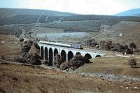 A class 31 on a northbound passenger train shortly after leaving Blea Moor Tunnel, photographed crossing Dent Head Viaduct around 1983. <br>
<br><br>[Colin Alexander //1983]