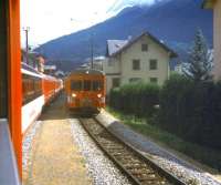 Scene on the western outskirts of Brig in August 1998 as a Zermatt-Davos Glacier Express waits in the loop for a Brig bound local train to pass.<br>
<br><br>[Fraser Cochrane /08/1998]