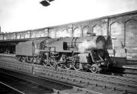 One of three Crosti boilered 9F 2-10-0s allocated to Kingmoor shed for a period, no 92024, stands at the south end of Carlisle station in July 1959. The locomotive was converted to conventional operation in 1960. <br>
<br><br>[Robin Barbour Collection (Courtesy Bruce McCartney) 04/07/1959]