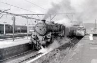 BR Standard class 5 no 73059 of Polmadie shed is about to take a train out of Gourock in the summer of 1966. The locomotive's final trip was undertaken in August the following year, to Campbells of Airdrie, a mere 13 years to the month after emerging new from Derby works. <br><br>[Colin Miller //1966]