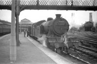 Parkhead V3 no 67662 is about to take a train out of Helensburgh Central and head for home in the late 1950s. In the right background stands the cramped 2-road Helensburgh shed (65H), officially closed in November 1970.   <br>
<br><br>[Robin Barbour Collection (Courtesy Bruce McCartney) //]