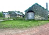 The station site at Whittingam in Northumberland, seen looking south east in August 2007. The site includes the old station, a sizeable yard, goods shed, station master's house and 5 terraced cottages.<br><br>[John Furnevel 08/08/2007]