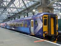 156433 waits at Platform 8 of Glasgow Central with an East Kilbride service on 13th February. This is the first Class 156 to have the new Saltire markings applied following last years extension of the First Group franchise by the Scottish government. <br><br>[Graham Morgan 13/02/2009]
