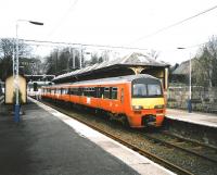 320 314 stands at Milngavie in March 1993 with a Springburn service, then the usual destination. Platform 2 track shows light usage.<br><br>[David Panton 30/03/1993]