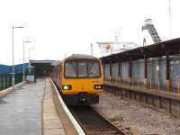 Having connected with the Isle of Man Ferry, 144004 waits to return to Leeds with the once a day service on the Heysham Port branch. The ship alongside the station is the brand new ferry <I>Clipper Panorama</I>, that was introduced on the Heysham to Belfast crossing around this time.<br><br>[Mark Bartlett 14/02/2009]