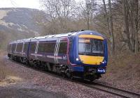 170 418 forms the 1159 Perth-Edinburgh service, just south of Lindores Loch on the Hilton Junction-Ladybank line<br><br>[Bill Roberton 20/02/2009]