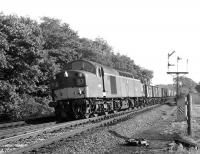 EE Type 4 no D335 heads north approaching Penrith at Eamont Bridge Junction in September 1967 hauling a partially-fitted mineral train.<br>
<br><br>[Colin Miller 25/09/1967]