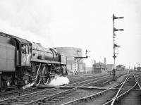 BR Standard Class 6 Pacific no 72006 <I>Clan MacKenzie</I>, at the head of a southbound freight, is held at Stirling in April 1965. <br><br>[Robin Barbour Collection (Courtesy Bruce McCartney) 16/04/1965]
