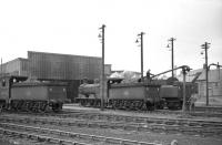 Bathgate shed hosts a pair of J36 0-6-0s, nos 65267 (left) and 65282 on 16 April 1965. The locomotive on the right is 76104. View north across the running lines. [See image 25412] <br><br>[Robin Barbour Collection (Courtesy Bruce McCartney) 16/04/1965]