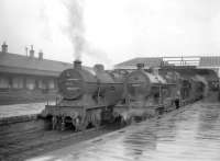 A pair of Hurlford shed's Fowler 2P 4-4-0s nos 40661 and 40689 wait with their trains in the bays at the north end of Kilmarnock station on 27 March 1959. On the left is the 4.16pm to Glasgow St Enoch and on the right the 4.13pm to Ayr.  Both locomotives had been withdrawn by the end of 1960.<br><br>[Robin Barbour Collection (Courtesy Bruce McCartney) 27/03/1959]