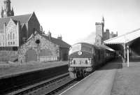 NBL Type 2 no D6141 about to take the 3.15pm train for Aberdeen out of Fraserburgh station in September 1963. Fraserburgh locomotive shed stands on the left.<br><br>[K A Gray 02/09/1963]