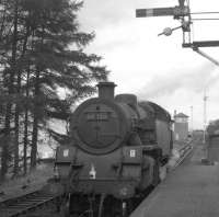 80028 on duty on the Killin branch train runs round at Killin Junction in 1965. The branch line turns off just before the signal box in the background with the Callander & Oban main line running straight ahead towards Glen Ogle. <br><br>[K A Gray //1965]