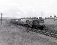 Glasgow-bound oil train passing Crookston circa 1966, with a Clayton having replaced the usual Black 5. [See image 19728]<br><br>[Colin Miller //1966]