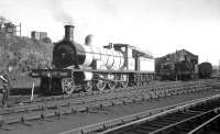 Prior to closure in 1964, Dawsholm shed played host to a number of historic locomotives used on the railtour circuit. Examples seen here in  1959 include the Jones Goods and Glen Douglas, both being cleaned, presumably in preparation for duties connected with the 1959 Scottish Industries Exhibition.<br><br>[K A Gray /09/1959]