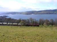EWS 66103 with a freight above the Gareloch between Rhu and Shandon in March 2009, as tree felling improves the views.<br><br>[John Robin 25/03/2009]