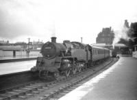 BR Standard class 4 no 80025 off Corkerhill shed prepares to take a train for Glasgow out of Ayr station on 28 July 1959.<br><br>[Robin Barbour Collection (Courtesy Bruce McCartney) 28/07/1959]