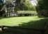 The cutting used by the Peebles Railway to negotiate the extensive grounds of the Peebles Hydro Hotel has long been filled in, although an old footbridge that crossed the line was left in situ. The bridge is seen here still in place on 18 May 2008 looking west towards the town along the ex-cutting. <br><br>[John Furnevel /05/2008]