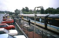 <I>The train at platform one is err on fire</I>. Locomotive 47 703 <I>St Mungo</I> hisses and spits as the Dunblane fire crew douses an engine room fire one morning in July 1988.  Heading the 7.44 service to Edinburgh, 47 703 looked unusually clean and perhaps freshly overhauled, giving rise to the suspicion that after a recent reassembly a few parts might have been left over<br><br>[Mark Dufton /07/1988]