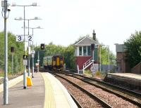 A Glasgow Central - Kilmarnock stopping service approaching platform 1 at Barrhead on 17 August 2006.<br><br>[John Furnevel /08/2006]