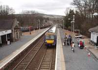 A Glasgow to Inverness service, formed by 170403, calls at Pitlochry in this view from the station footbridge looking south towards Dunkeld and Birnam.<br><br>[Mark Bartlett 30/03/2009]