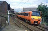A Strathclyde Orange 320 enters Partick from the north in the mid 90s.<br><br>[Andy Kirkham //]