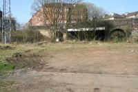 Looking west from the bottom of Birkenshaw Street on 2 April 2009 towards the site of the former Haghill Junction. The CGU line from Duke Street comes in from the left and runs across the picture, through the central span of the bridge carrying Cumbernauld Road, to reach Alexandra Parade station standing just beyond. The line to Parkhead  Junction (closed 1981) turned off below the bridge and ran towards the camera, passing to the east of Haghill Junction signal box and the yard which stood in the V of the junction. [See image 11306]<br><br>[John Furnevel 02/04/2009]