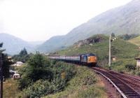 A class 37 with a train from Mallaig approaching Glenfinnan station in 1984. <br><br>[Andy Kirkham //1984]