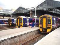 Motive power line up under the trainshed at Inverness in March 2009 comprising (L to R) 158702, 158731 and 158741. On the far left 170403 can partly be seen having arrived from Glasgow. <br><br>[Mark Bartlett 30/03/2009]