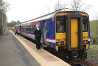 A Glasgow Central - East Kilbride service waits to depart from Thorntonhall on 6 April.<br>
<br><br>[John Steven 06/04/2009]
