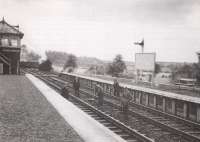 A PW gang photographed at Riddings Junction around 1964 with Willie Whittaker (hand on hip) nearest the camera. In the background a Pacific is approaching with a Waverley route freight from the Carlisle direction while on the island platform to the right  the station nameboard declares <I>Riddings Junction change for Canonbie Gilnockie and Langholm</I>.<br>
<br><br>[Joyce Barker Collection (Courtesy Langholm Archive Group) //1964]
