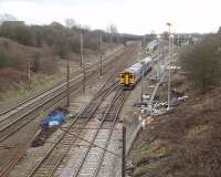 Prior to the Easter weekend relaying of Farington Curve Junction there was considerable preparatory work including creating a new access road and the installation of lighting columns. This view of 158855 negotiating the junction on a York to Blackpool service shows these preparation works.  <br><br>[Mark Bartlett 27/02/2009]
