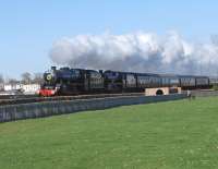 The <I>Great Britain II</I> railtour leaves Arbroath southbound on Sunday 12 April running alongside <I>Kerr's Miniature railway</I> hauled by 45407 and 45231. <br><br>[Sandy Steele 12/04/2009]