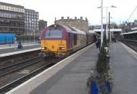 67 003 with the EWS-stocked 1708 Fife Outer Circle service, standing at Haymarket, with more spare seats than normal, being Good Friday 10 April 2009.<br><br>[David Panton 10/04/2009]