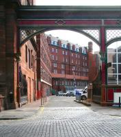 On the south side of Rutland Street the former entrance to Edinburgh's Princes Street station still stands, complete with gates, in April 2009. The rear of the Caledonian Hotel still looks over the area once occupied by the station concourse, although today's view is over a car park to the buildings of Edinburgh's financial district.<br><br>[John Furnevel 07/04/2009]