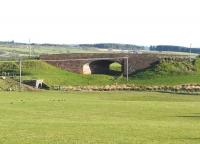 A notable skew arch bridge at Gilmourton, near the site of the former Drumclog station in South Lanarkshire, seen in April 2009. Beyond the bridge towards Darvel is the sprawling Loudounhill Quarry. This section of the Caledonian between Strathaven and Kilmarnock closed in 1951. <br><br>[Ken Browne 21/04/2009]