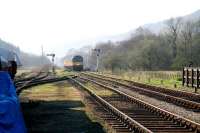 The last of the early morning mist still hangs over the moors as D7628 approaches Levisham with the first train of the day for Grosmont on 20 April 2009.<br><br>[John Furnevel 20/04/2009]