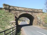 The twin railway bridges that cross the unclassified road over the North Yorkshire Moors, in the remote countryside between the A169 and the village of Goathland, photographed looking west on 20 April 2009. The nearest of the two bridges carries the current NYMR south from Goathland towards Levisham, while the bridge in the distance is on the original 1836 alignment, much beloved of horse-power and cable haulage, prior to its closure in 1865 in favour of the easier route.<br>
<br><br>[John Furnevel 20/04/2009]