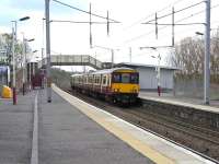 Scene at Wishaw on 29 April, as 318 255 calls with a Lanark to Dalmuir direct service.<br><br>[David Panton 29/04/2009]