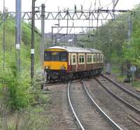 318 256 takes the east to north curve at the busy Hyndland East Junction on 2 May heading for the stop at Anniesland, thence either north to Milngavie or west via Singer.<br><br>[David Panton 02/05/2009]