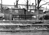 Part of Darlington Works scrapyard showing the <I>stores</I> in May 1962. These stores, based on the grounded body shells of two former <I>Sentinal</I> locomotives, would have held cutting gear and various tools and equipment necessary to carry out the day to day work of the yard. The two Sentinals already subjected to the cutters torch in this unusually creative way are nos 68149, formerly of 51F, West Auckland and 68180, late of 50C, Selby. The building in the background is North Road station, while behind the camera, on the south side of what is now a green field, stands the old Stockton & Darlington Railway's Hopetown carriage works, recently in the news as the location where 60163 <I>Tornado</I> was built by the A1 Steam Locomotive Trust [See image 21065]. <br>
<br><br>[David Pesterfield 27/05/1962]