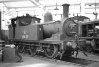 J72 0-6-0T no 69028 stabled inside one of the roundhouses at Gateshead shed in October 1964.<br>
<br><br>[Robin Barbour Collection (Courtesy Bruce McCartney) 24/10/1964]