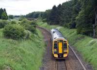 Bathgate - Edinburgh train approaches the site of Bangour Junction on the single line branch in June 2007. <br><br>[James Young 26/06/2007]