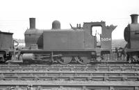 Ex-Caledonian <I>Beetle Crusher</I> 56154, one of the sturdy McIntosh 2F 0-6-0T (original 498 Dock Class) locomotives, stands in the sidings at the Rutherglen end of Polmadie shed, probably in 1959. The locomotive was withdrawn from Polmadie in June of that year and cut up at Cowlairs Works 5 months later. [With thanks to John Robin]<br>
<br><br>[K A Gray //1959]