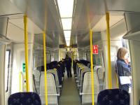 The mock up of the new Class 380 train at Platform 11 of Glasgow Central showing the interior layout. The seating arrangement will be 2+2 and not 3+2 as in the Class 318 and Class 334, giving more space to move around.<br><br>[Graham Morgan 19/05/2009]