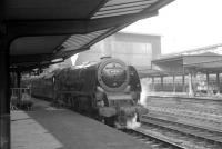 Stanier Pacific 46250 <I>City of Lichfield</I> at Carlisle in 1964 about to take out the 9.00am Perth - Euston train from platform 3.<br><br>[K A Gray 29/02/1964]