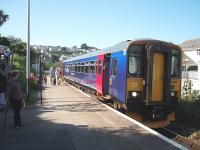 A sizeable number of passengers leaves <I>Bubble Car</I> 153361 at Carbis Bay, having made the short but scenic journey down from St. Ives. The train will continue to the junction at St. Erth calling at Lelant Saltings Park and Ride on the way.<br><br>[Mark Bartlett 18/09/2008]